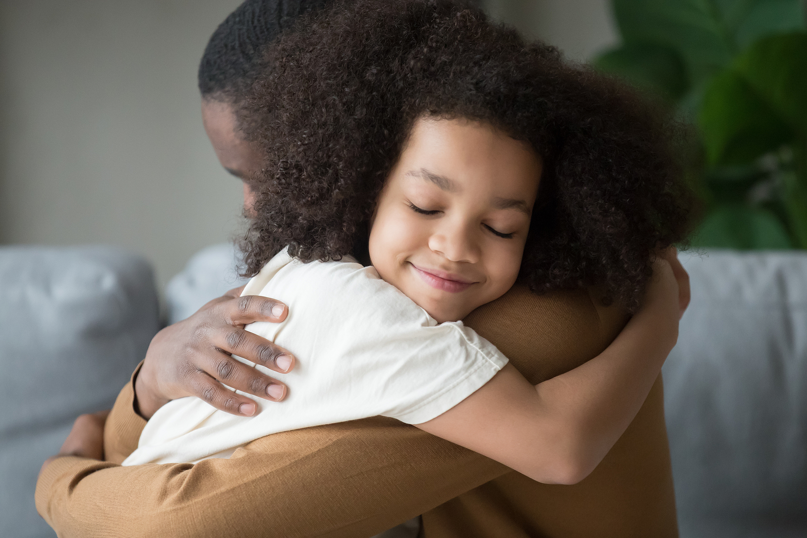 father hugging his daughter