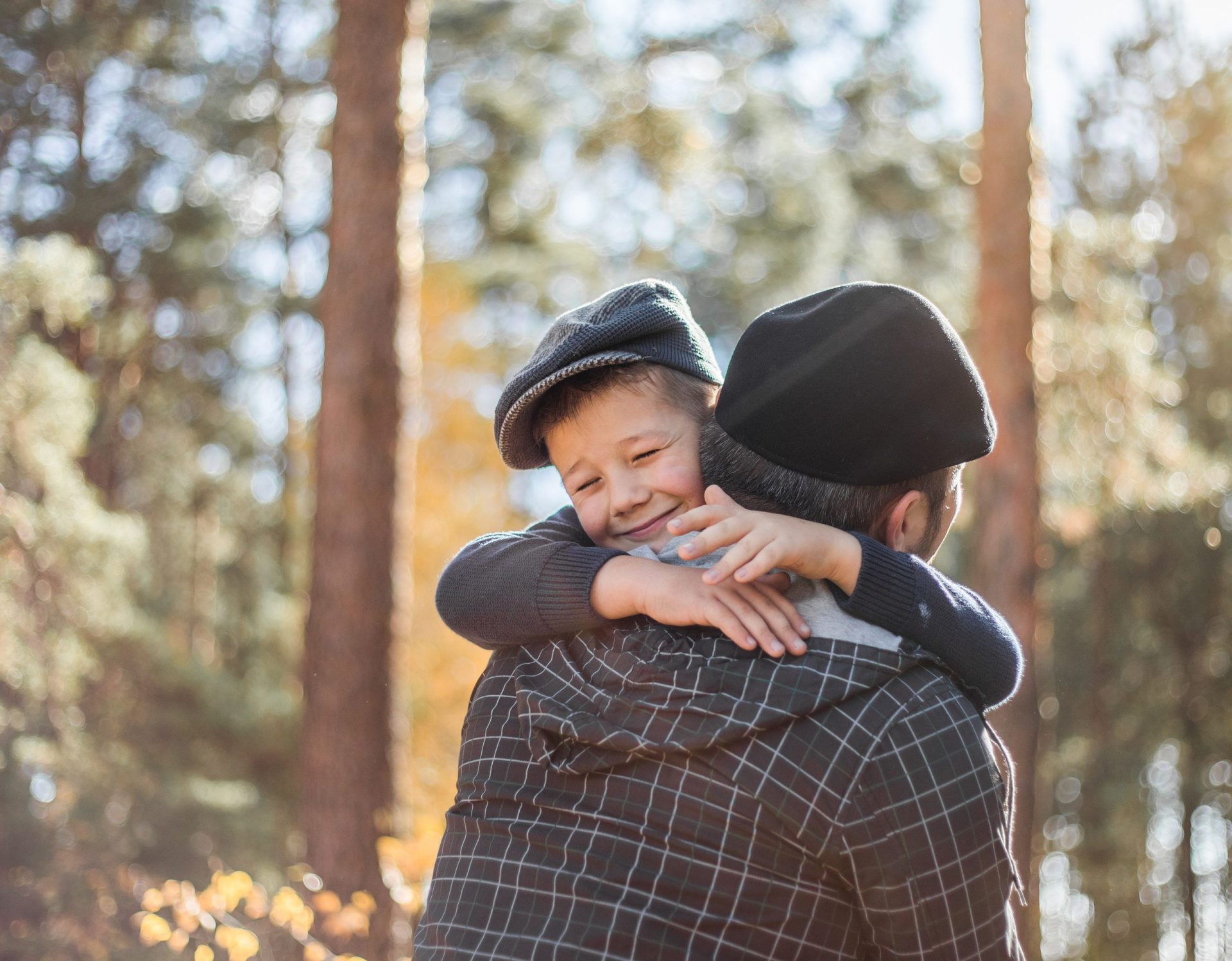 father hugging his child